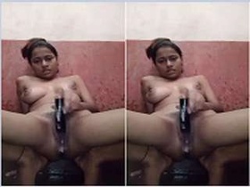 Black girl masturbates with a bottle in steamy video