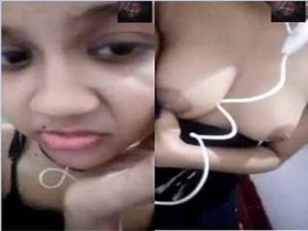 A stunning girl flaunts her large breasts on a video call