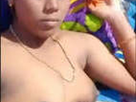 Indian girl displays her breasts and vagina