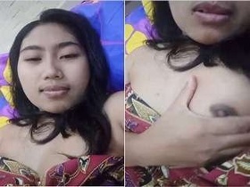 Adorable girl reveals her breasts and vagina
