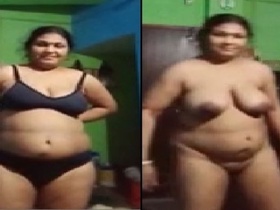 Mature village woman strips naked and teases in front of camera