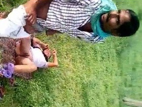Indian locals catch a horny couple in an open field during XXX action