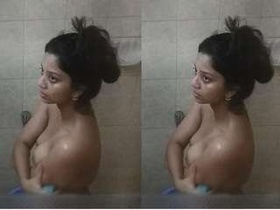 Secretly filmed: A stunning woman soaping up in the shower