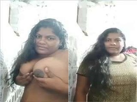 Girl with large breasts displays them for the camera