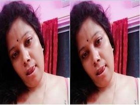 Horny Indian girl Budi proudly displays her large breasts