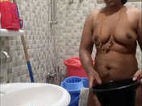 Tamil auntie films herself bathing in the shower