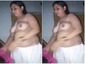 Desi bhabhi bares her breasts and pussy
