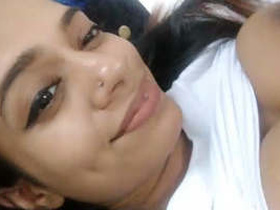 Cute Sri Lankan girl records a video of herself taking selfies