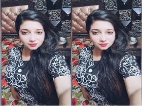 A Pakistani girl flaunts her large breasts in a seductive manner