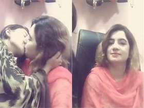 Two young Indian lesbians kissing passionately in a steamy video