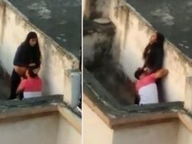 Desi wife caught on camera licking her partner's pussy on the balcony