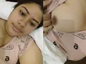 Young woman flaunts her juicy, natural breasts