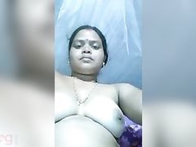 A frustrated Indian auntie engages in fake penis sex action