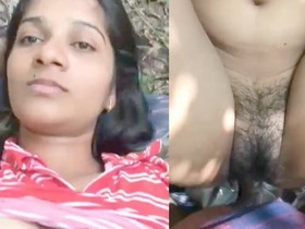 Cute Indian girl pleasures herself outdoors