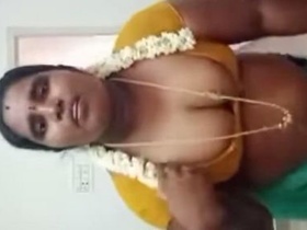 Big-breasted Tamil aunty gets naughty in this video