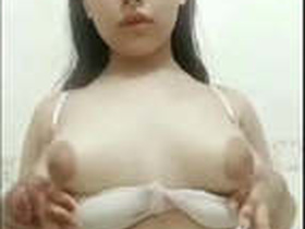 Desi babe flaunts her cute boobs and presses them against the camera