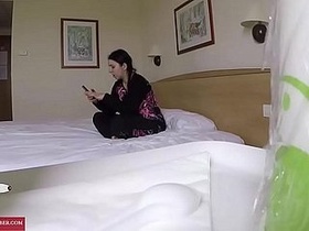 Hidden cam captures a hotel room orgy in progress.