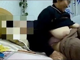Chinese granny gets naughty in erotic video