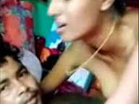 Rural Indian wife rides her husband in the countryside