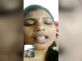 Tamil wife indulges in phone sex with her boyfriend in a steamy scene from the movie