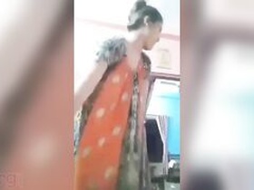 Desi Budi, a bangladeshis bhabhi with big black mamba hair, fingers herself in this porn video
