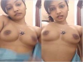 Desi Indian girl strips down and flaunts her breasts for cash