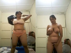 MILF mom strips down and shows off her big boobs on camera