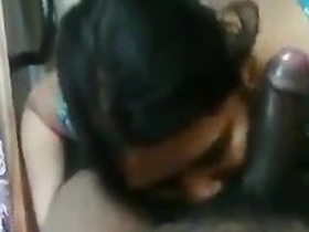 Indian wife gives her husband a blowjob in their home for his pleasure