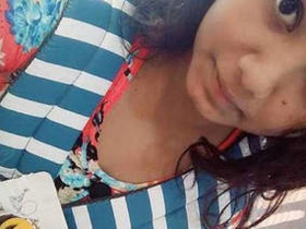 Watch a hot Indian college girl unveil her breasts for her partner