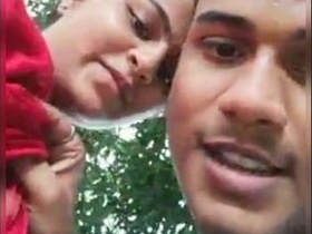 Desi couple's outdoor romance in a village setting