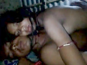 A married couple enjoys intimate moments in the nude at night