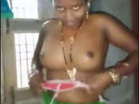 Desi bhabhi gives a blowjob while changing into a sexy dress