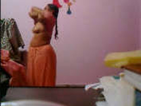 Secretly recorded footage of a mature bhabhi's saree removal