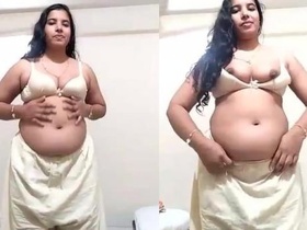 Mallu Bhabi's busty and big ass show