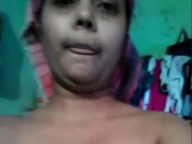 Indian bhabhi masturbates her pussy with her fingers in front of camera