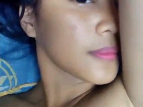 Horny girl pleasures herself with her fingers and pink pussy