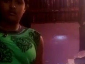 A young Tamil girl shows off her cute boobs in a steamy video