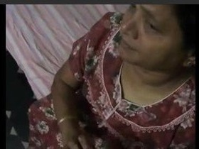 Neelina, an Indian wife, pleasures herself in explicit video