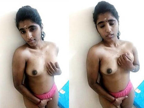 A busty Indian girl flaunts her breasts