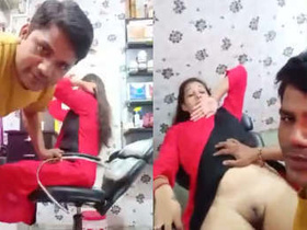 A romantic couple shares a passionate moment at the salon