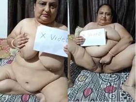 Indian auntie flaunts her big tits and pussy