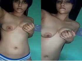 ExclusiveCute girl teases with her breasts on camera