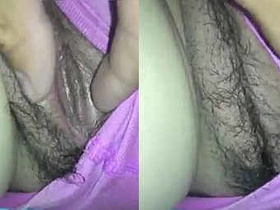Hubby pleasures his wife's pussy in this steamy video