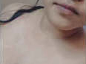 A stunning woman shows off in the bathroom
