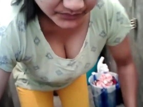 Horny aunty flaunts her massive cleavage while doing laundry