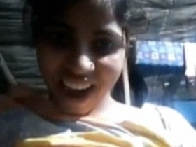 A country girl bares her breasts in a seductive video call