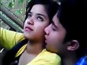 Cute Indian couple smooching in secluded spot