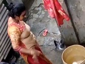 Hidden camera captures Indian woman undressing and bathing